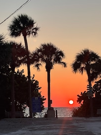 Sunset view from beach access drive in front of apartment.