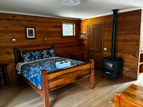 Gas fire that looks like a log burner and door to ensuite bathroom