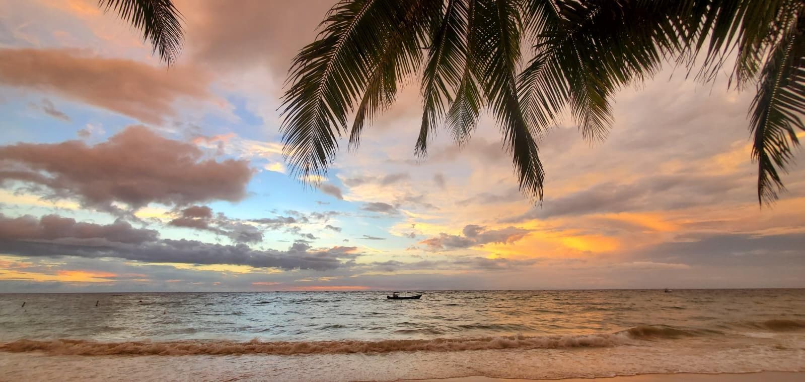 Watching the sunset at the beach steps from the hotel.