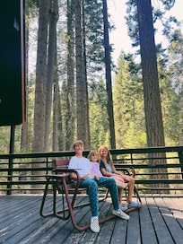 kids enjoying the glide rocker on the big beautiful deck