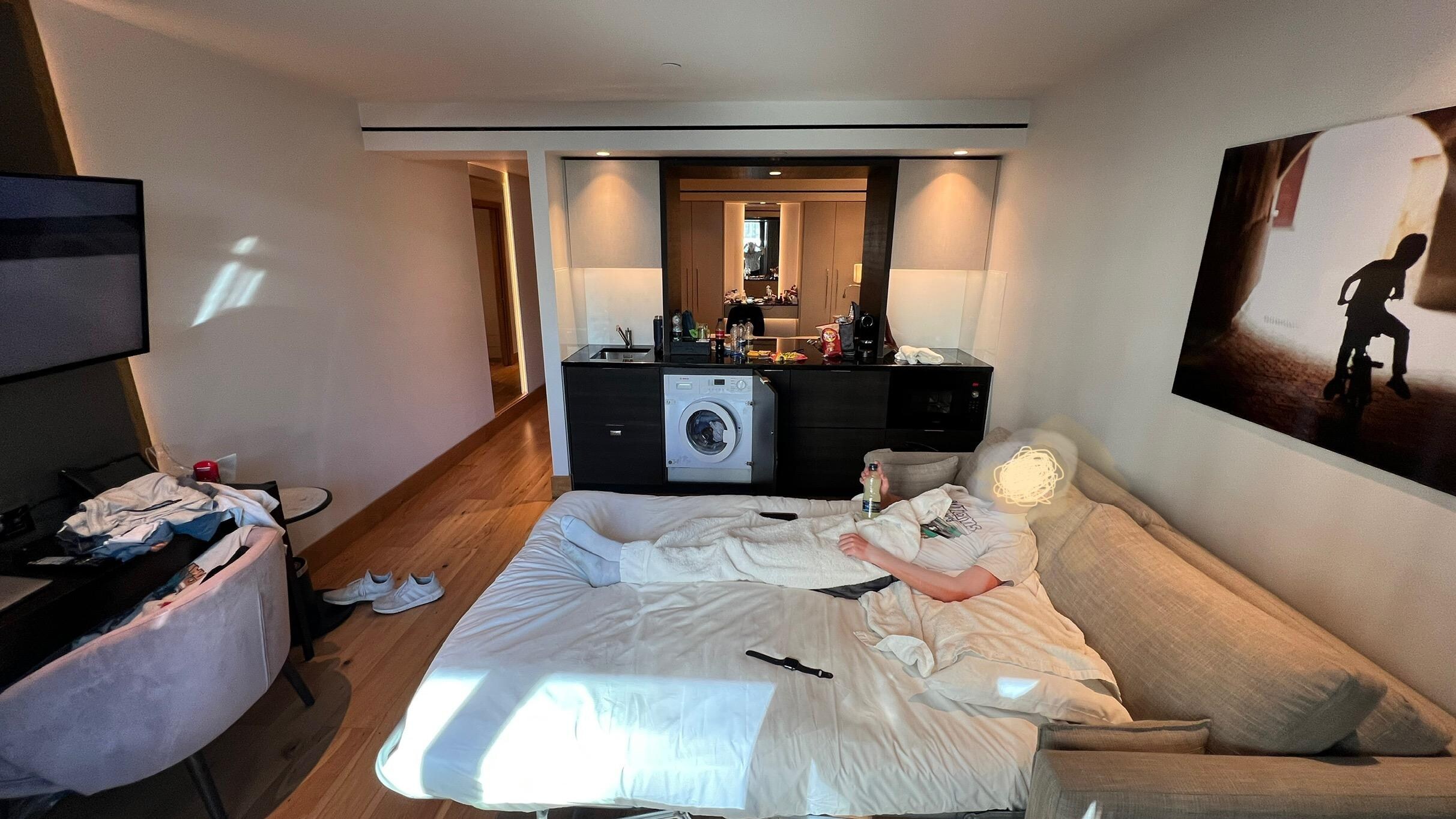 Living room with sofa bed and kitchenette