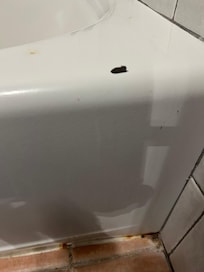 Chipped and rust around tub