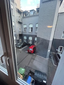 Our view from the window, the open dumpster right below our window did not smell nice in the summer heat.