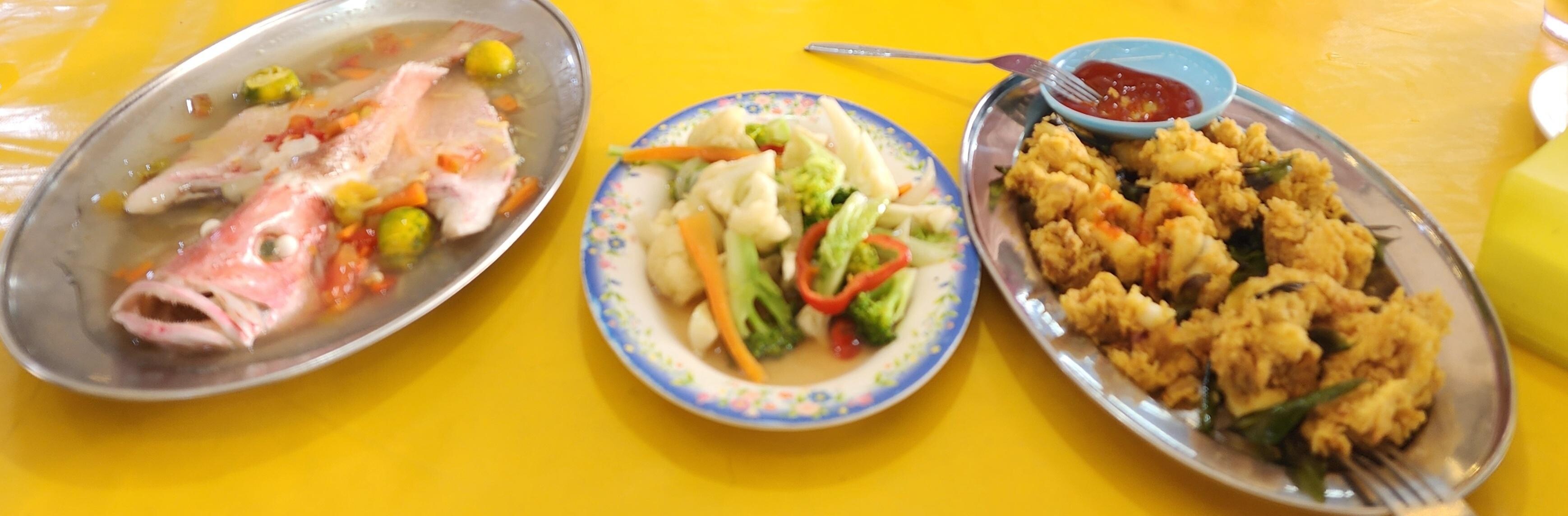 Freshly cooked red emperor, with rice, vegetables and calamari.