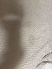 Stained bedspread