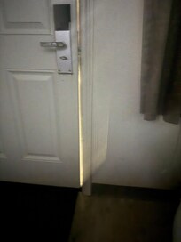 This is the door closed and looked. Walls dirty room not clean