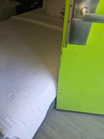 The bed was hit by the door.