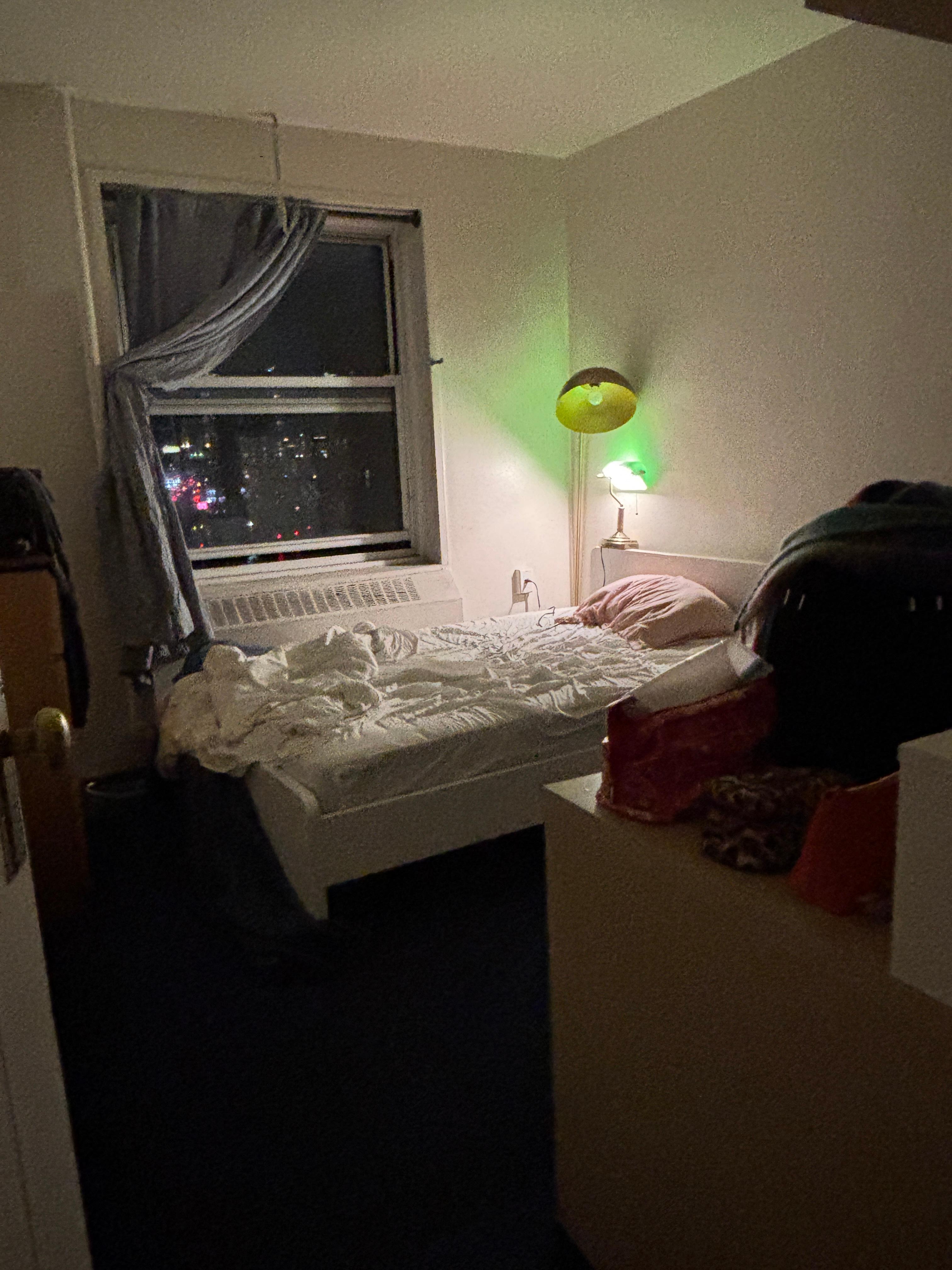 small bed and limited lighting