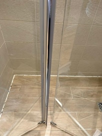 Broken shower door and moldy shower