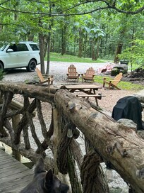 Fire pit is nice setup along with picnic table and bbq grill.