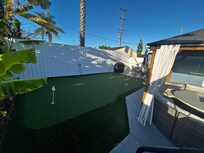 Putting green and grill. Propane tank supplied but you may need to fill up the tank if empty.