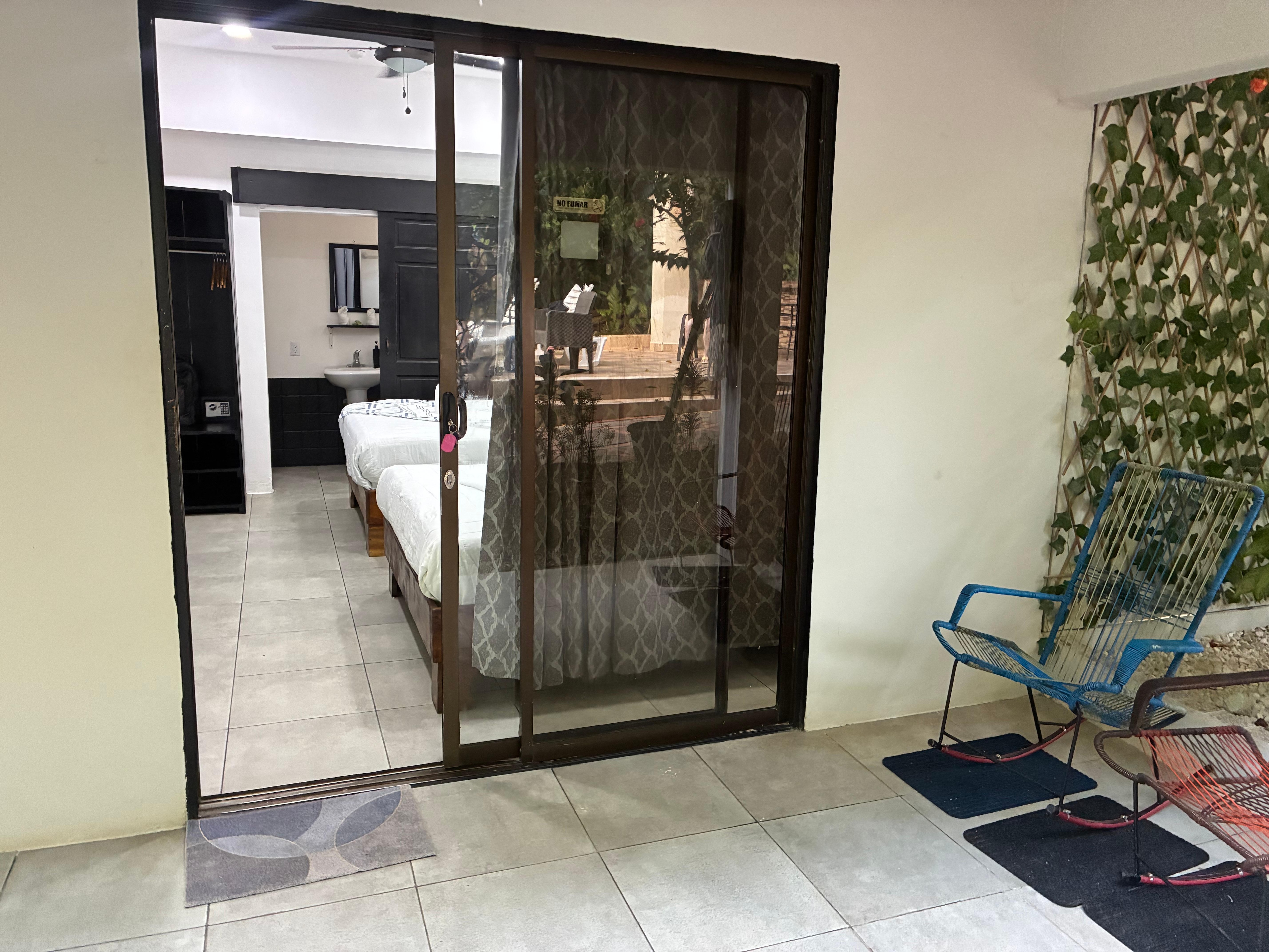 Lanai with hammock and chairs right next to pool