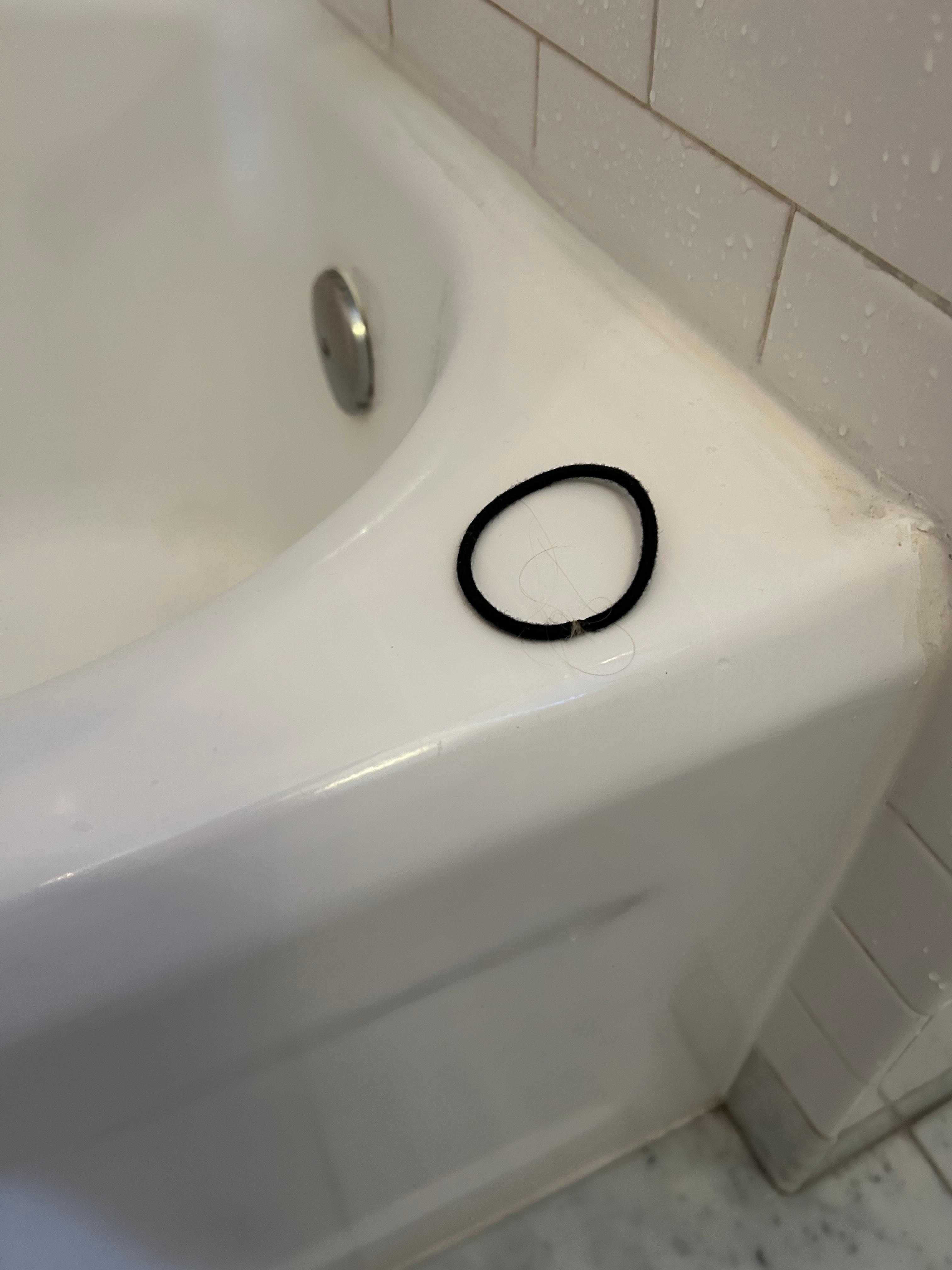 Found a (used) hair band in our shower.