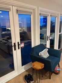 Back patio doors opening to the Ocean. Usually when you rent an AirBnb or VRBO you want to be able to open the doors to the beach. Not here...They had a post it note saying they are under repair?