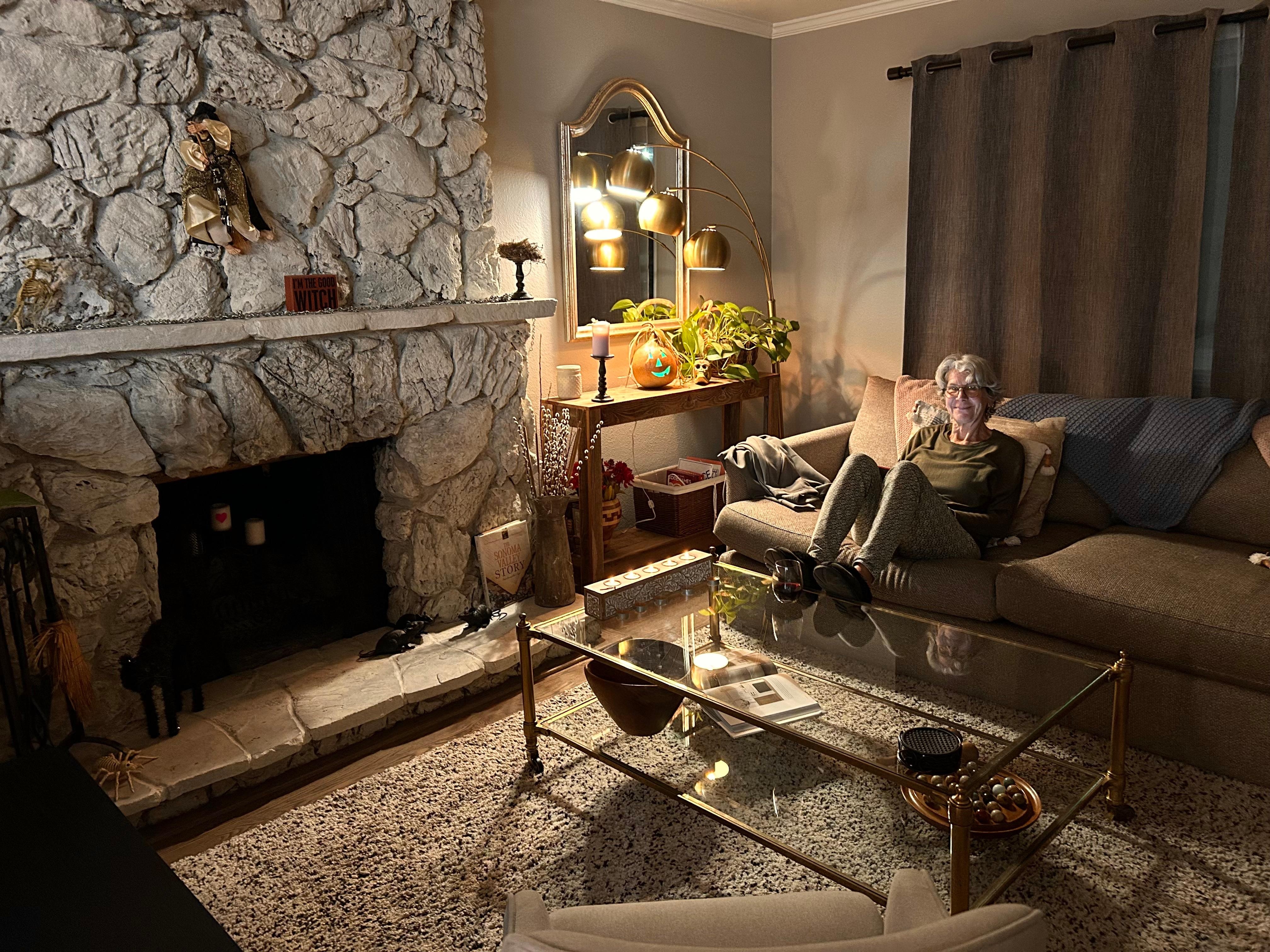 Cozy living room - ready to watch a movie, with candle light and super fun Halloween decorations