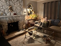 Cozy living room - ready to watch a movie, with candle light and super fun Halloween decorations