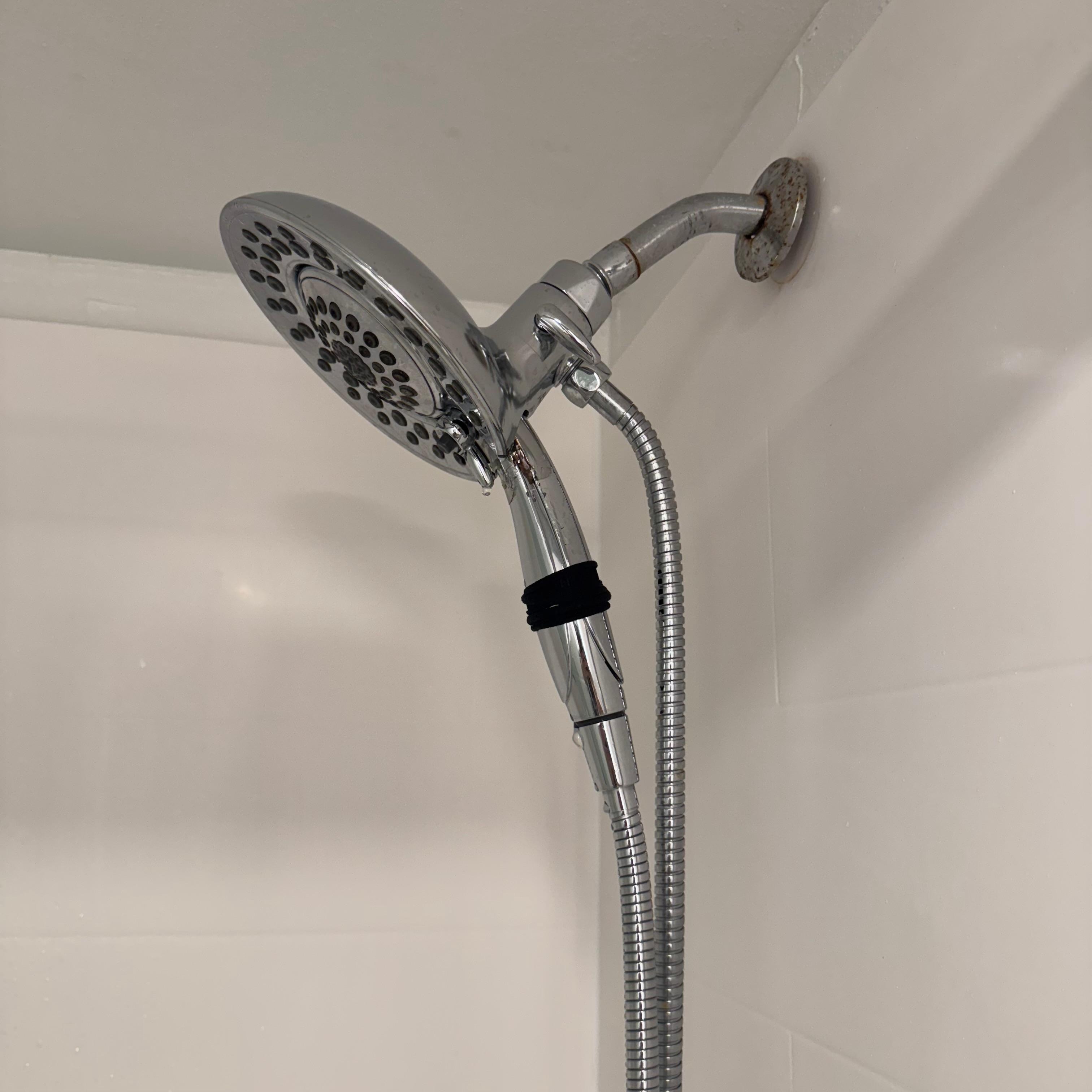 shower sprayer broken hair tie held it together