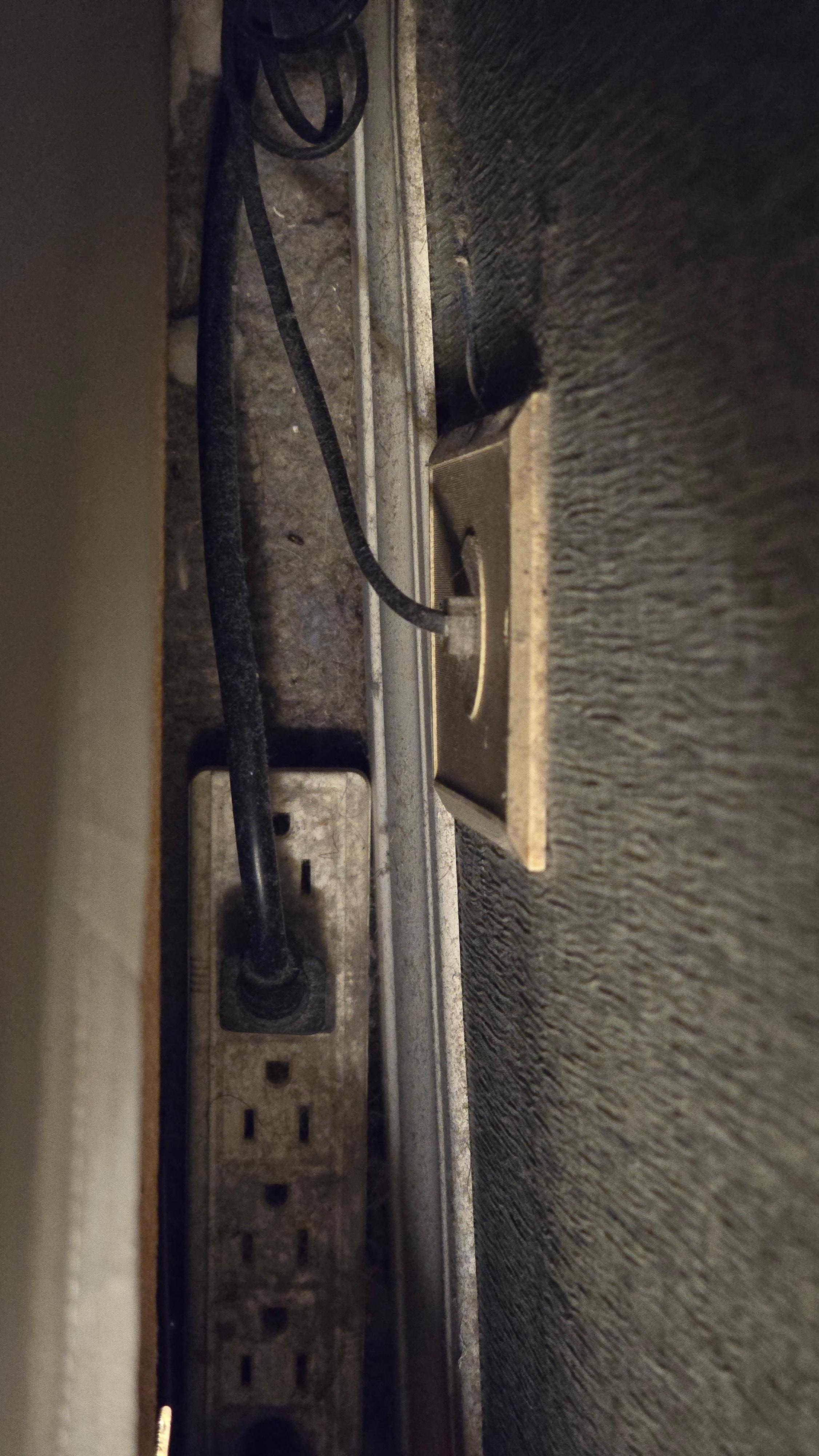 Looks like a dead animal behind the headboard and enough dust to plant a garden.