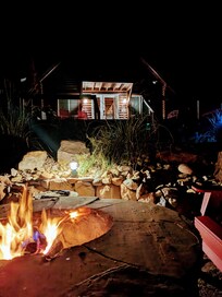 Looking at the house from the fire pit by the river.