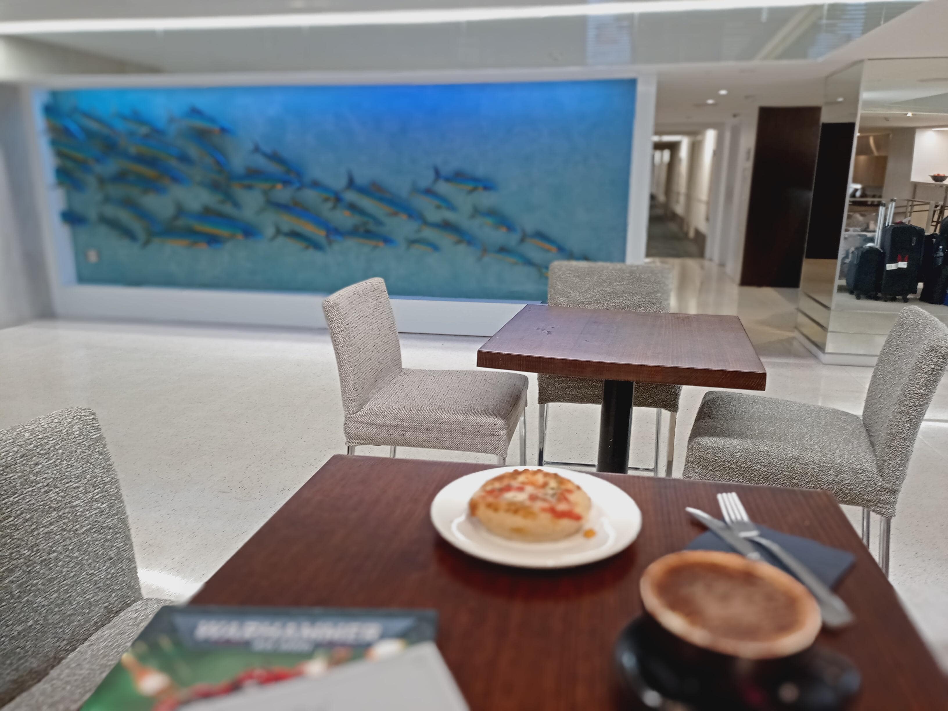 View of art on the lobby wall from the café