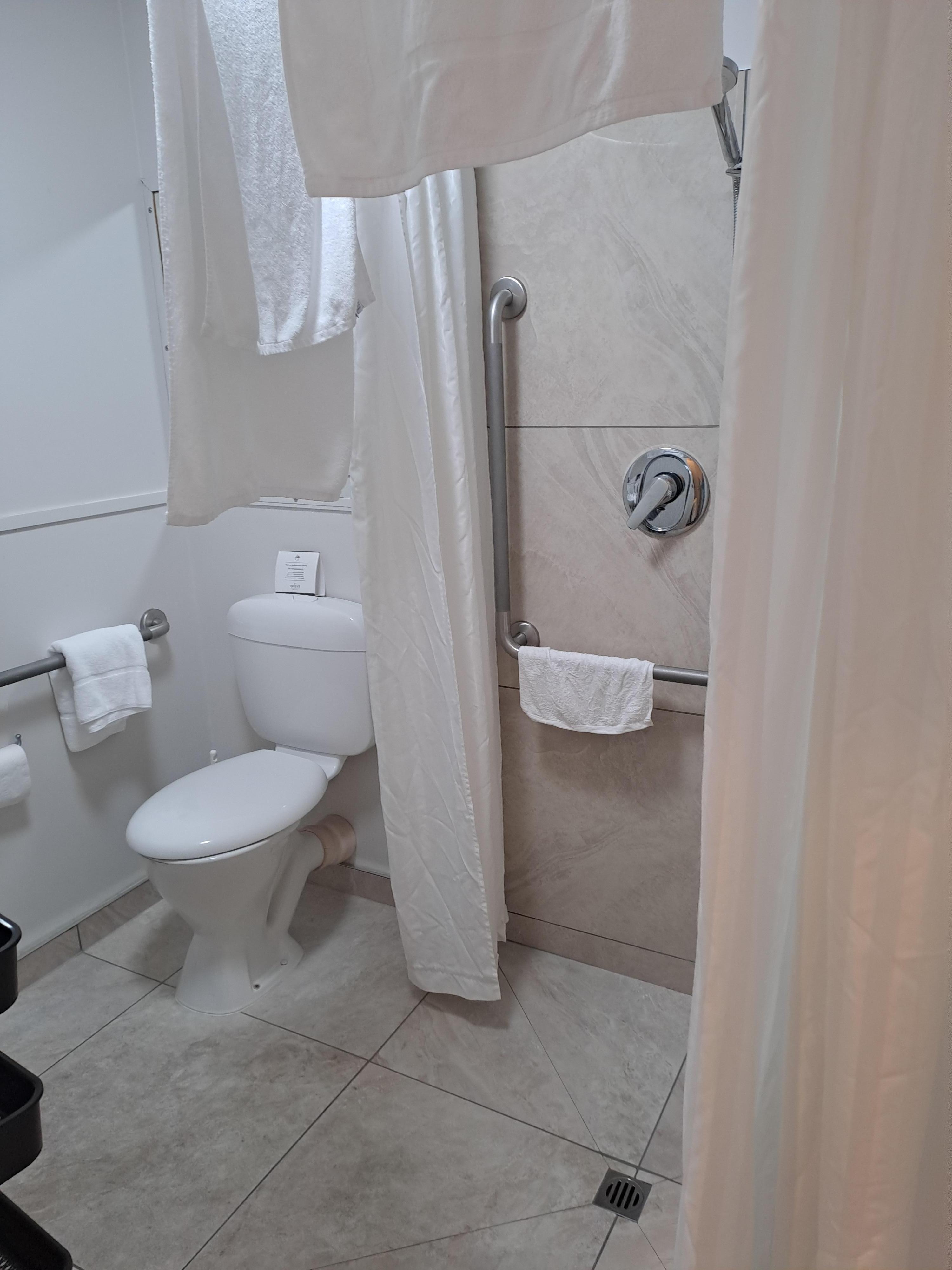 Bathroom accessible.  Only shower curtain so floor all wet after a shower 