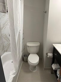 Bathroom with a bathtub visible on the left