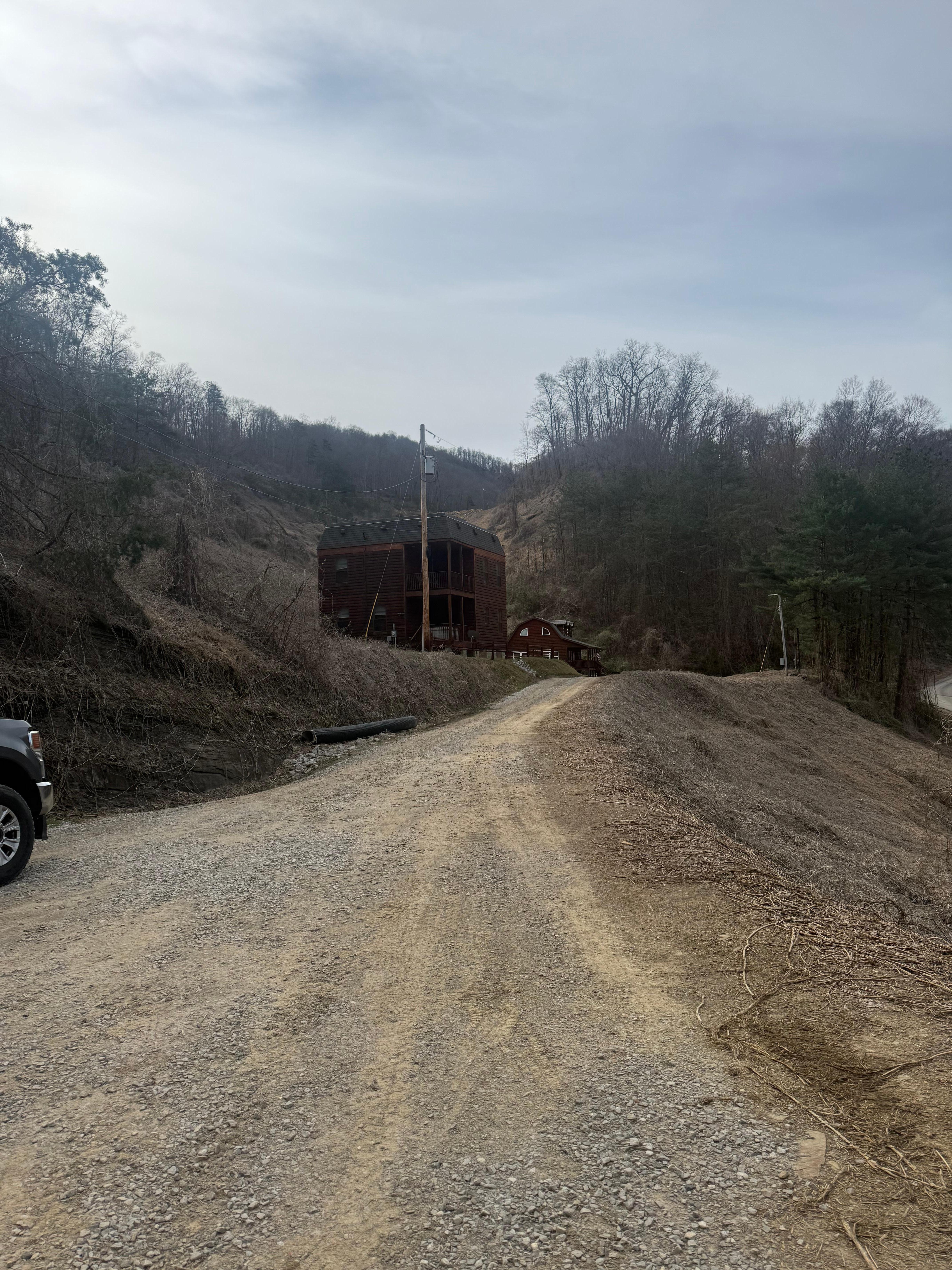 Driveway to the cabin backed in with truck and trailer