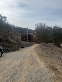 Driveway to the cabin backed in with truck and trailer
