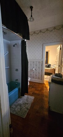 Bathroom easily accomodated her bath bench and walker .