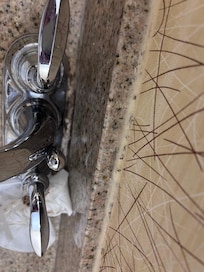 Behind sink faucet