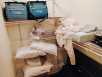 Closet no hangers but dirty blanket and stuff in bedroom closet