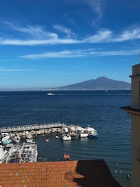 Rooftop terrace view of the harbour and Mount Vesuvius