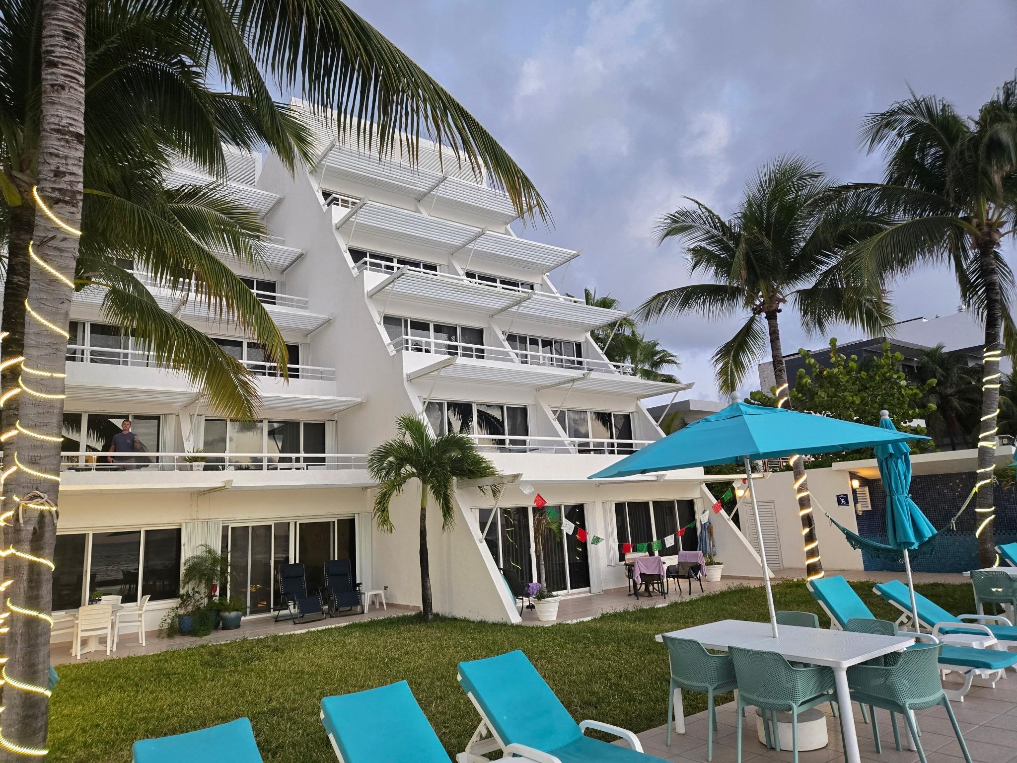 Pool Area south hammocks, pool shower, palm trees - friendly neighbors. 