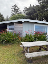 Front of cabin, picnic table with ocean view