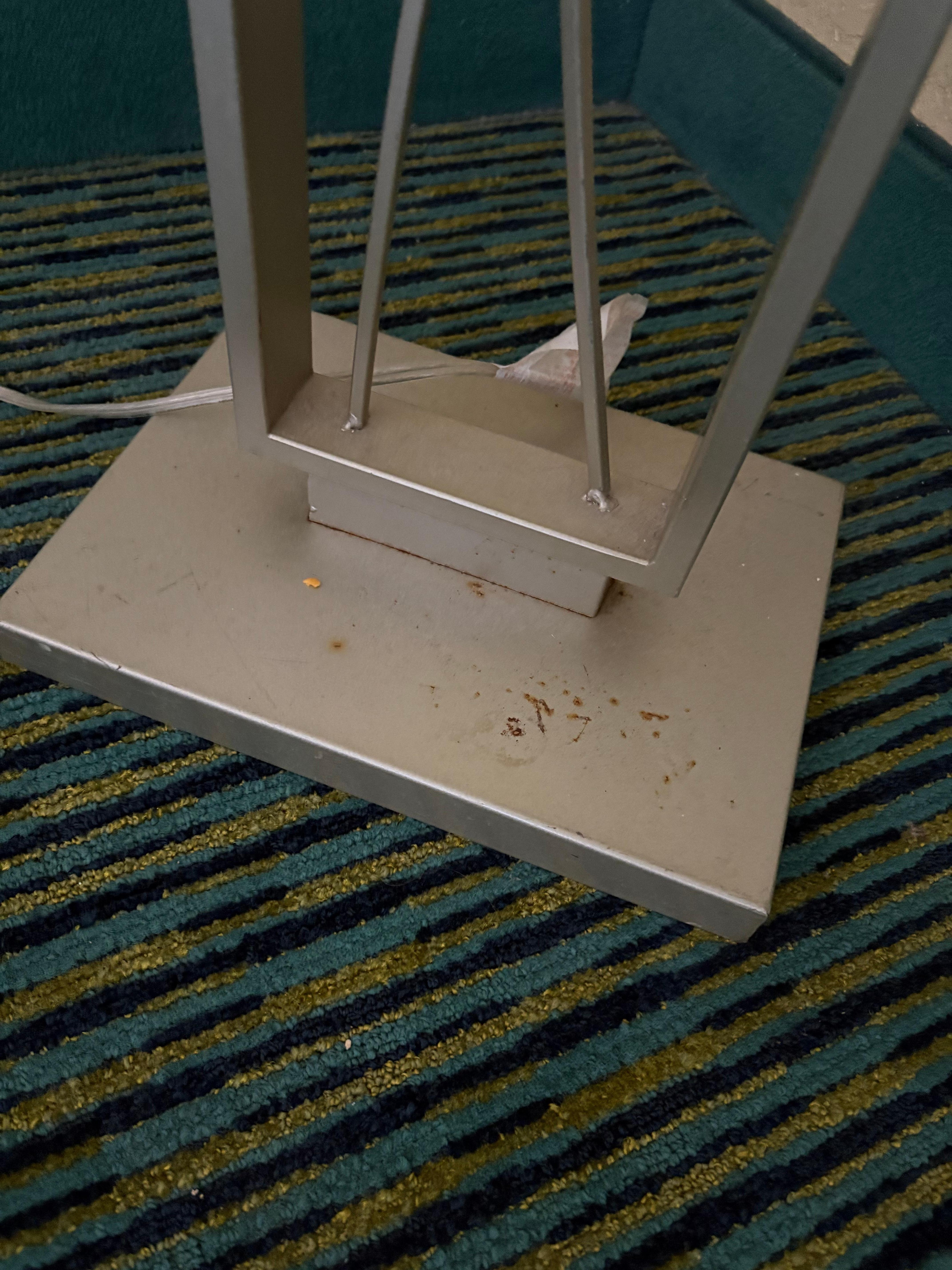 Corner floor lamp covered in who knows what