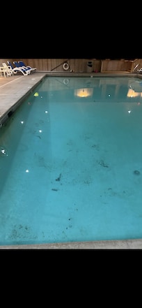 Run down pool that was open for use and very very dirty.