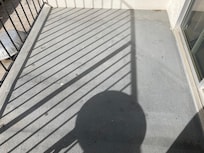 Cracked and badly stained balcony.