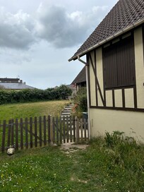 Outside of this home with cute yard