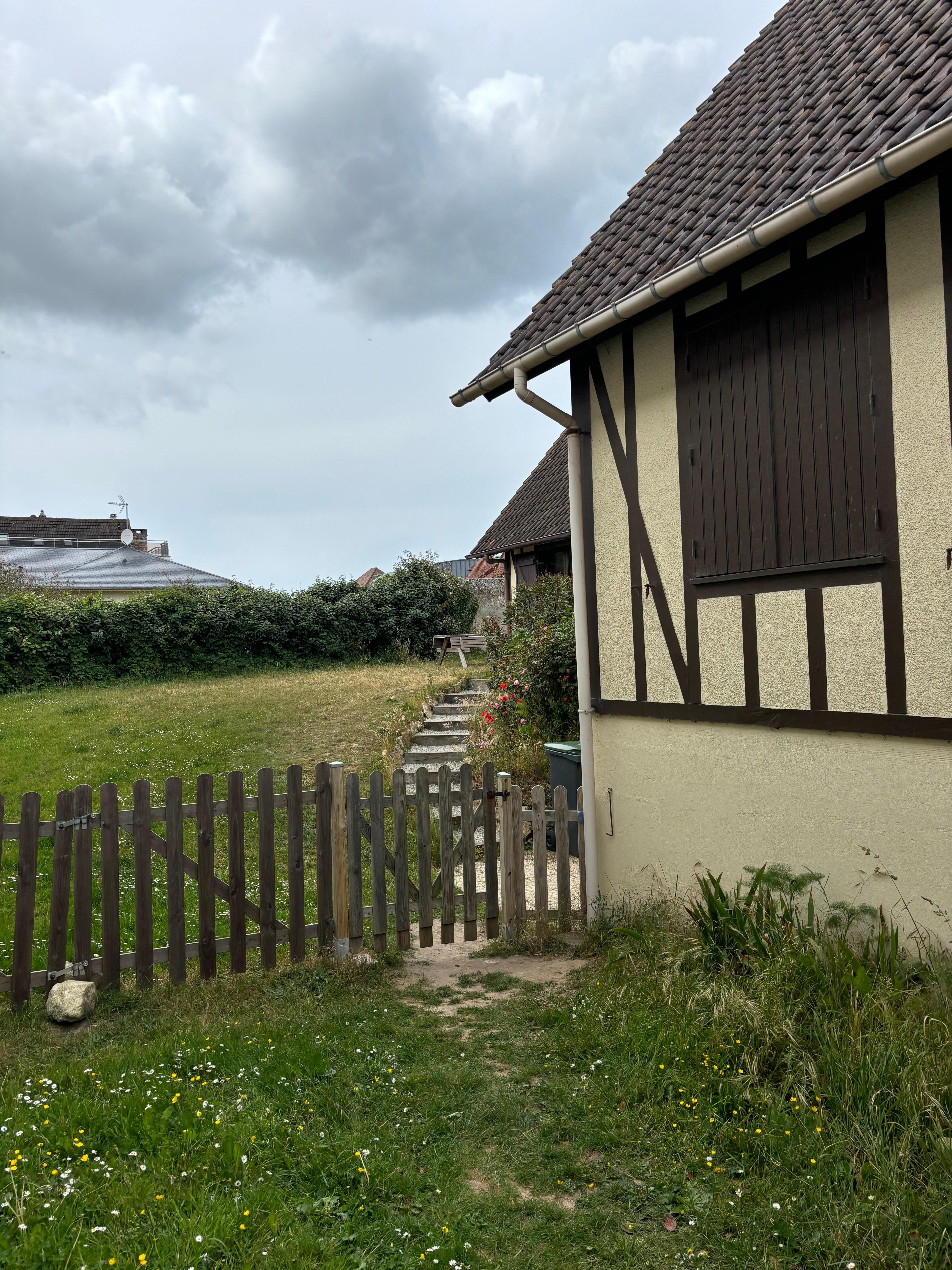 Outside of this home with cute yard