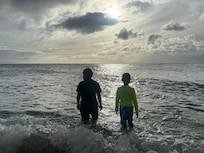 The kids enjoying the small beach area adjacent to the property.