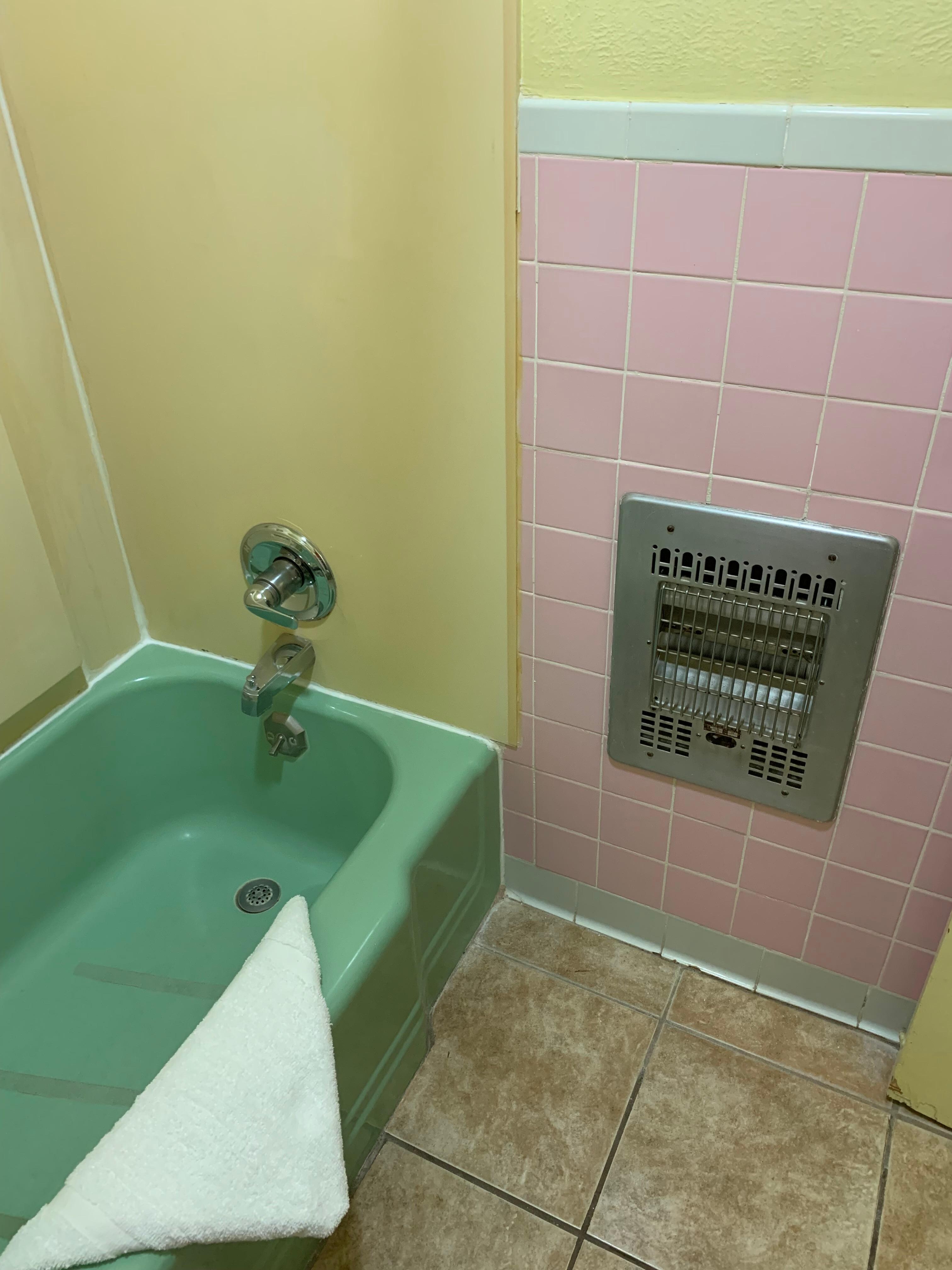 Ancient electric fire in bathroom