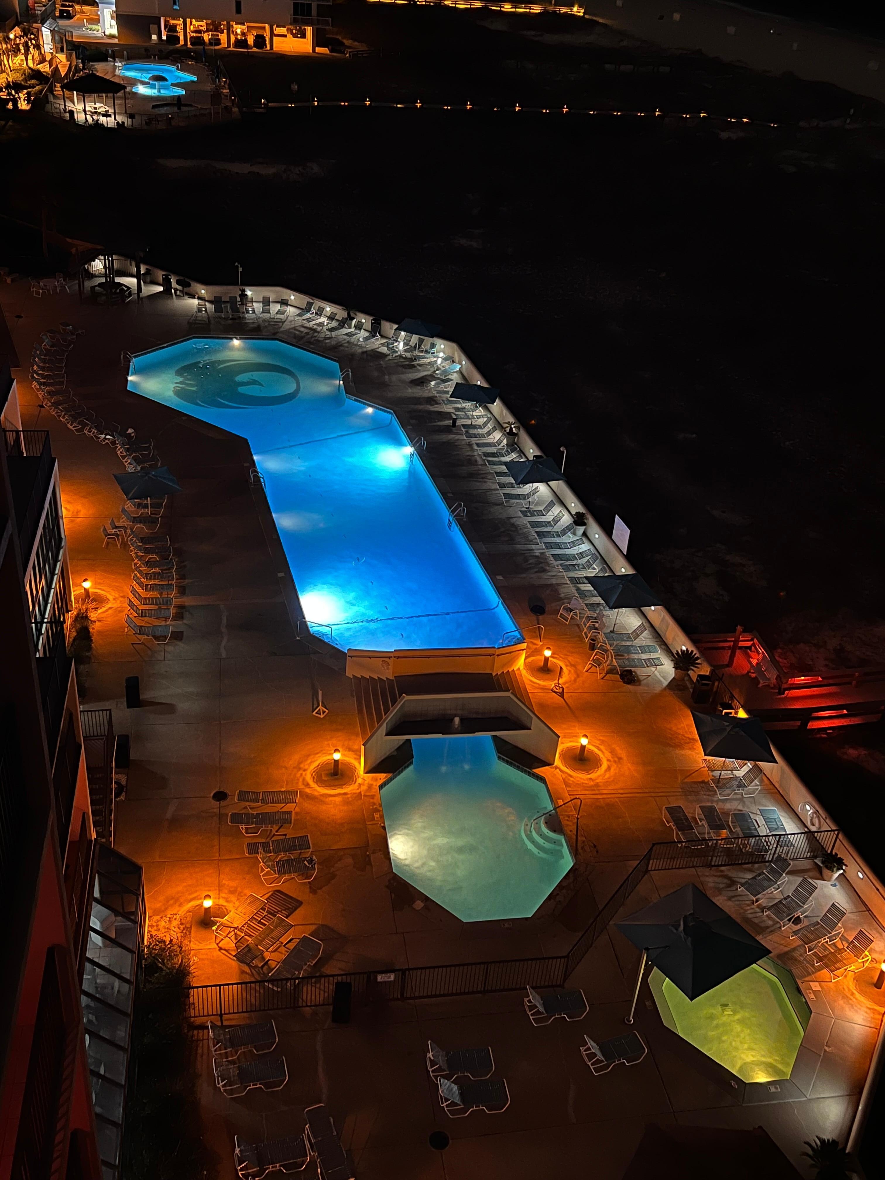 Pool lit up at night 
