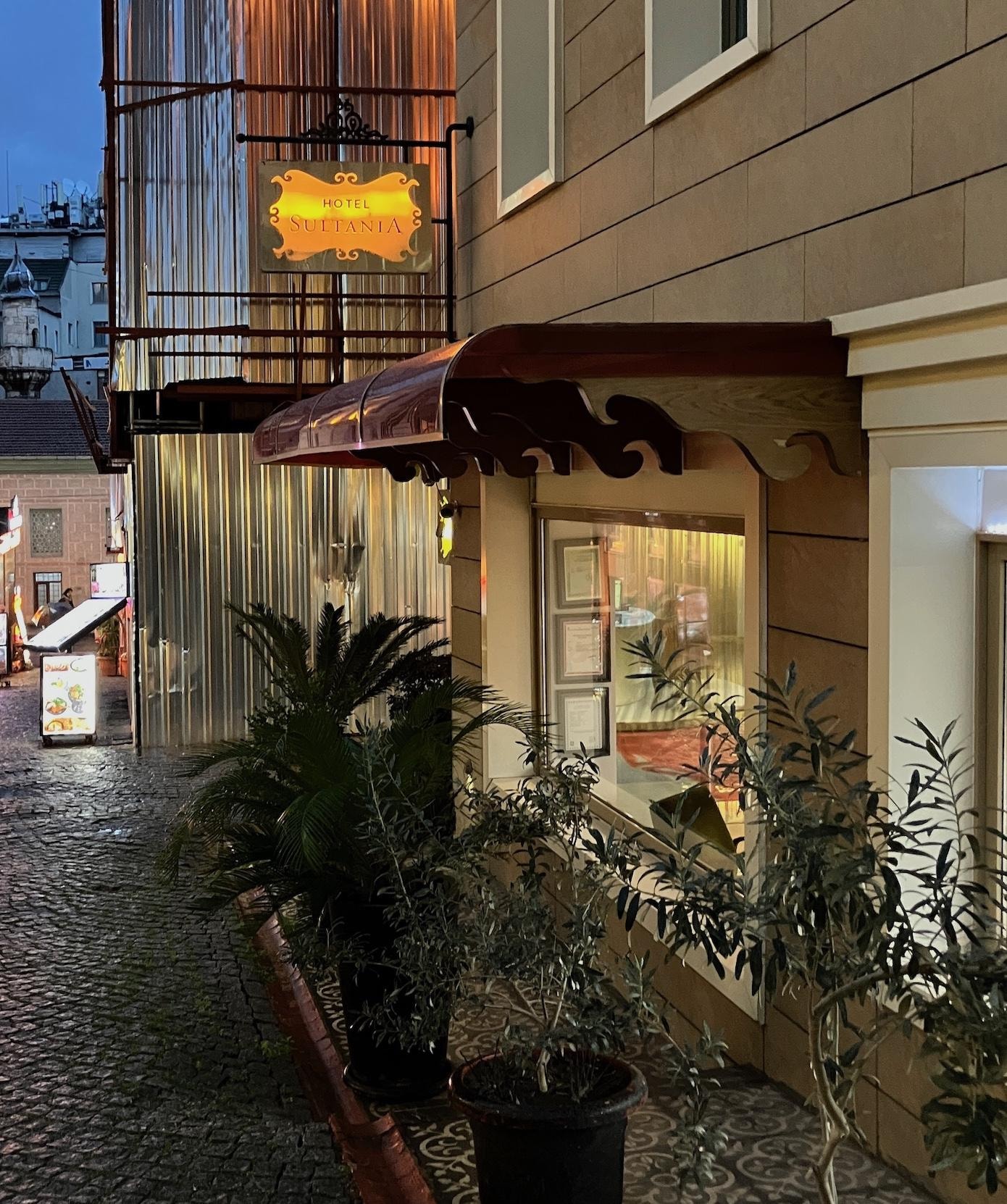 exterior of the hotel down a pedestrian, cobblestone lane