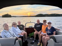 Family on patio boat tour of the lake