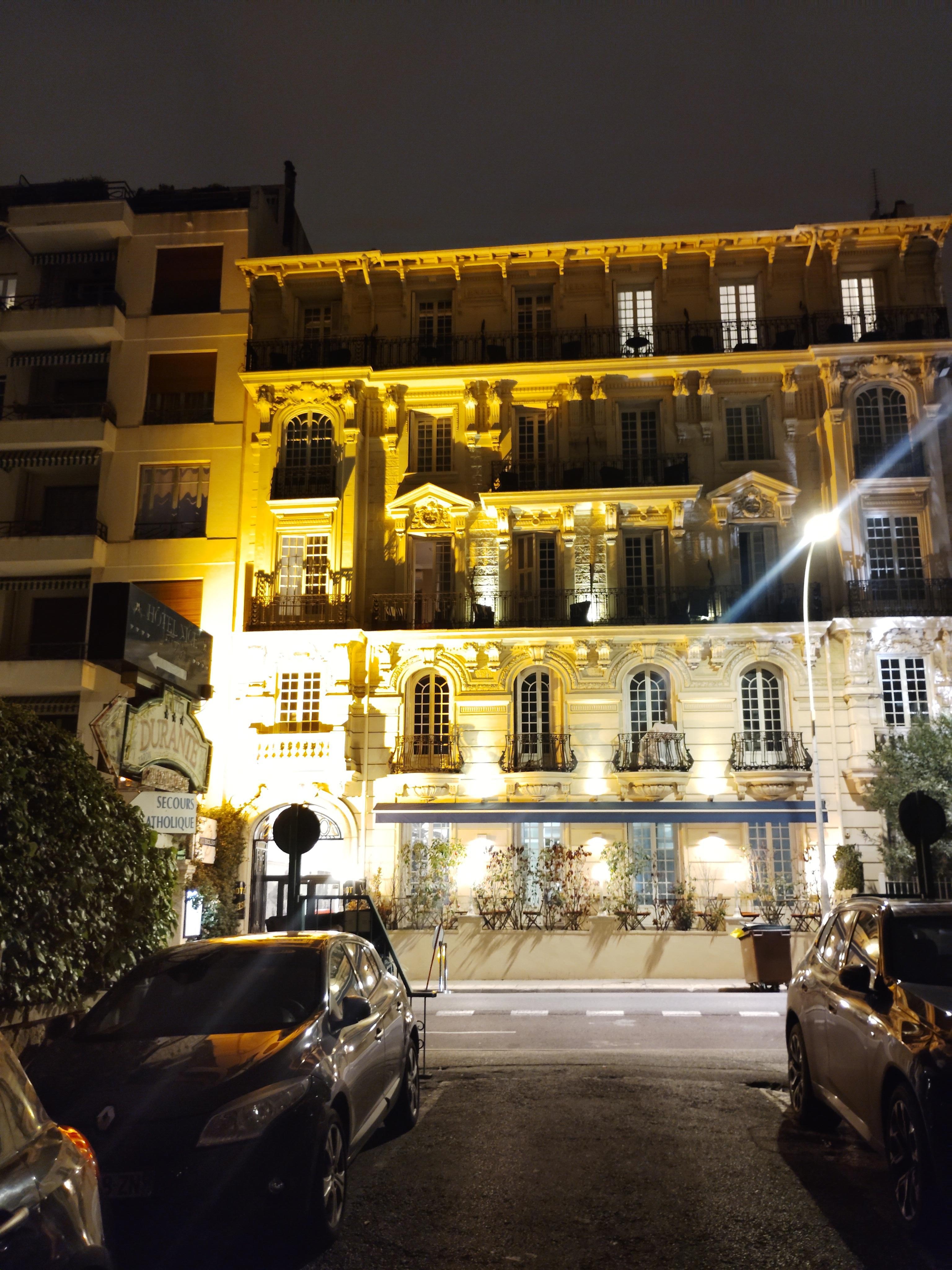 building at night at the end of the street