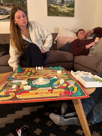 Hanging out playing board games in one of the living rooms