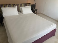 The bed on the mezzanine.