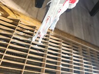 Plastic bad melted into the grate located under the dining table. It burned our child's foot badly.