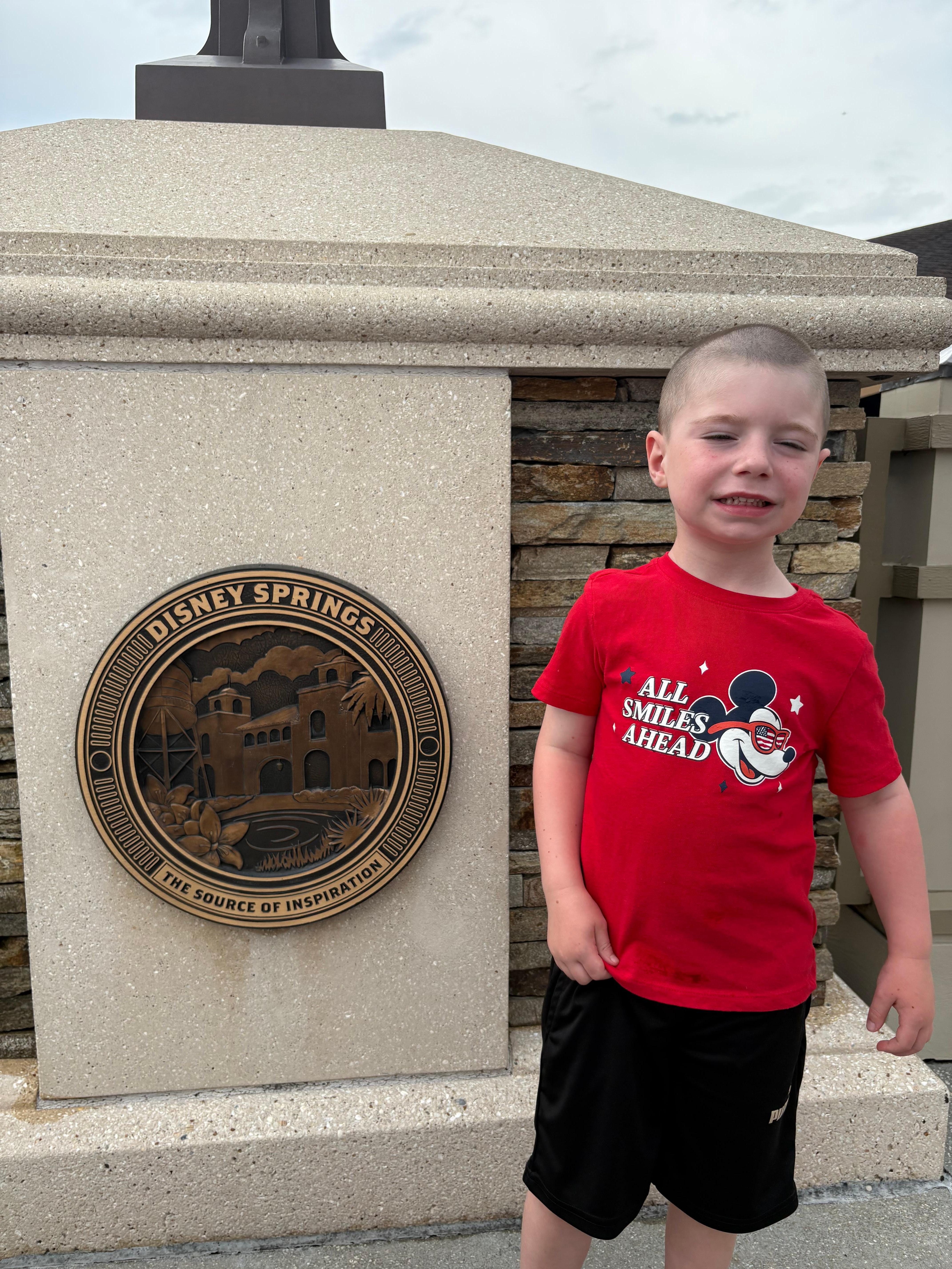 My son so happy at Disney Springs