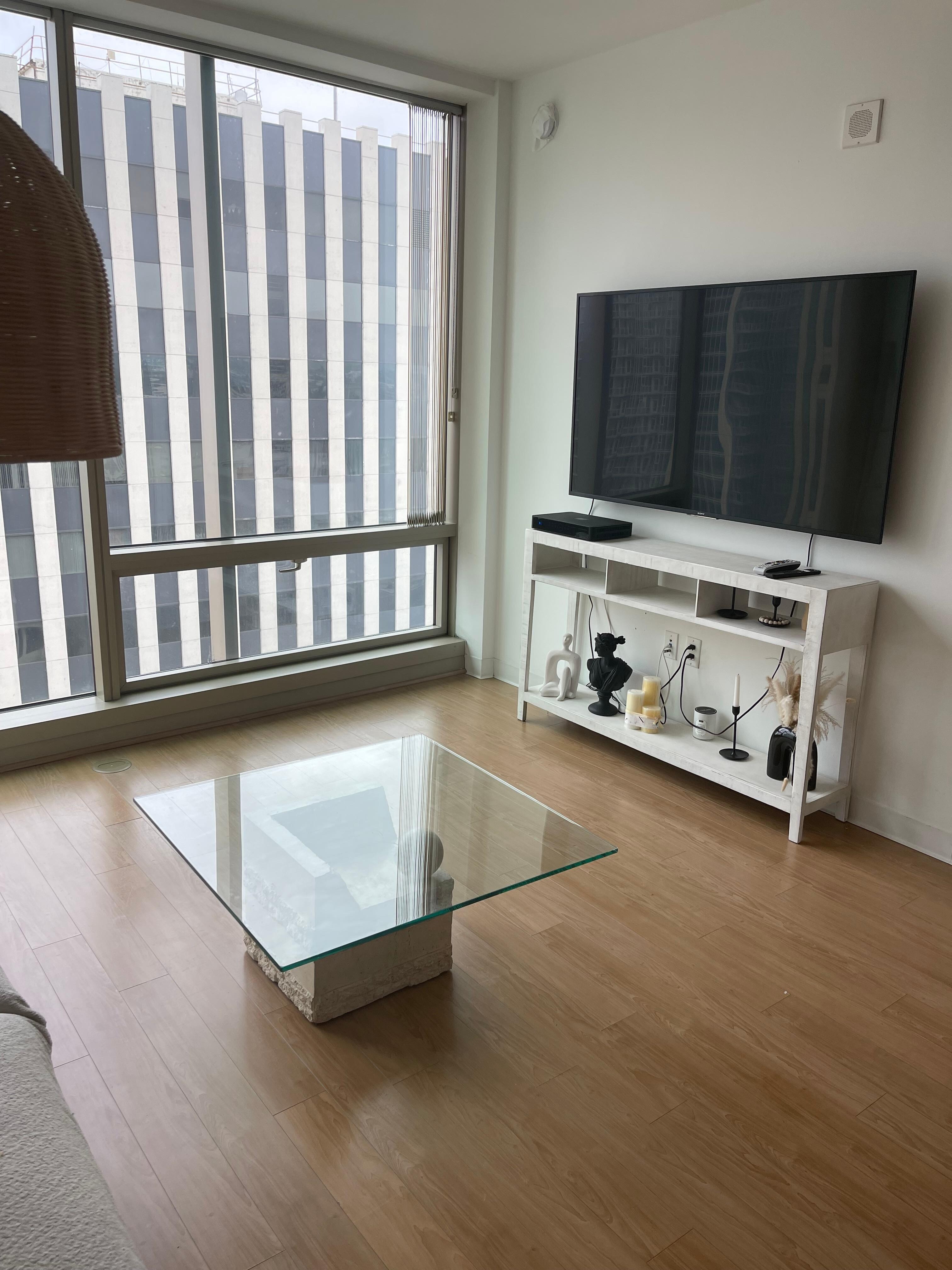 Living room area with big building blocking view